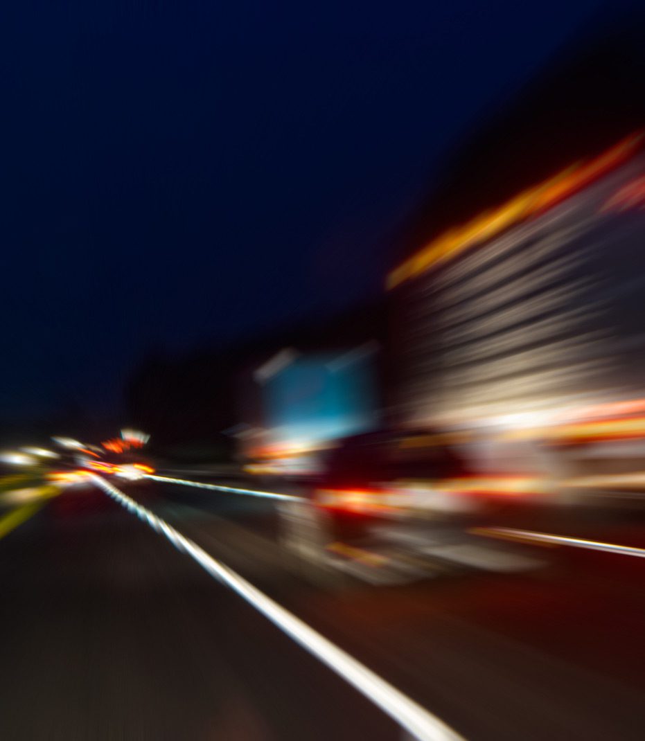 Blurry-view-of-highway-due-to-impaired-driving-at-night