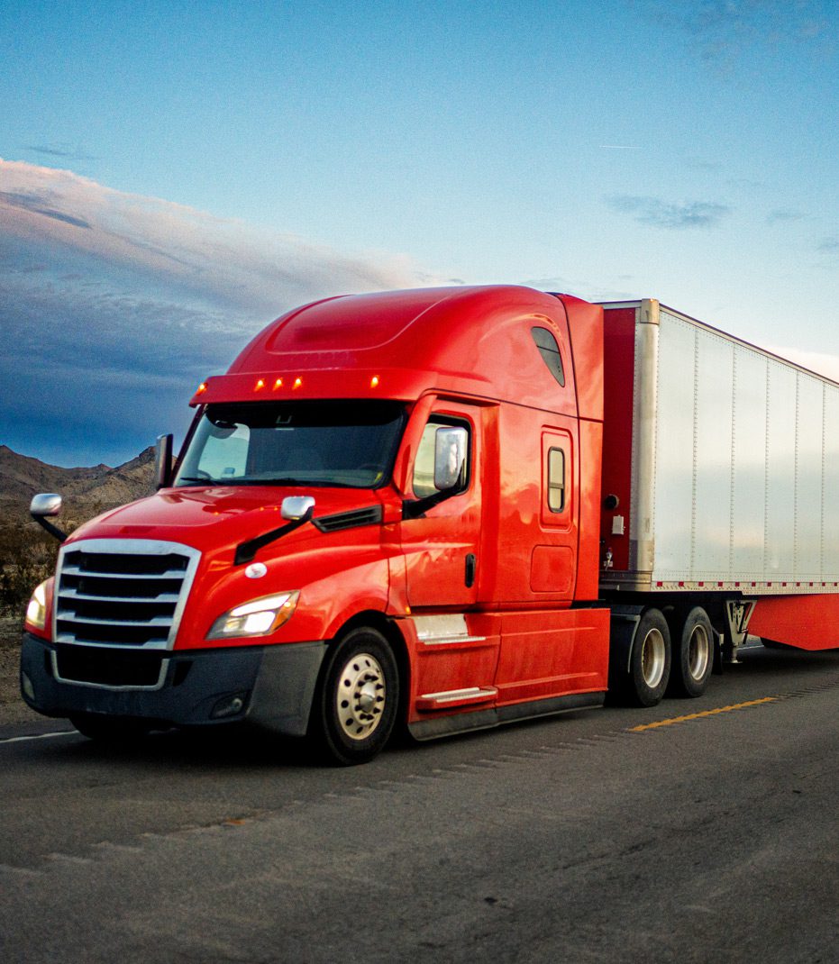 Red-semi-truck-on-a-highway-at-risk-of-accident-due-to-manufacturer-faults