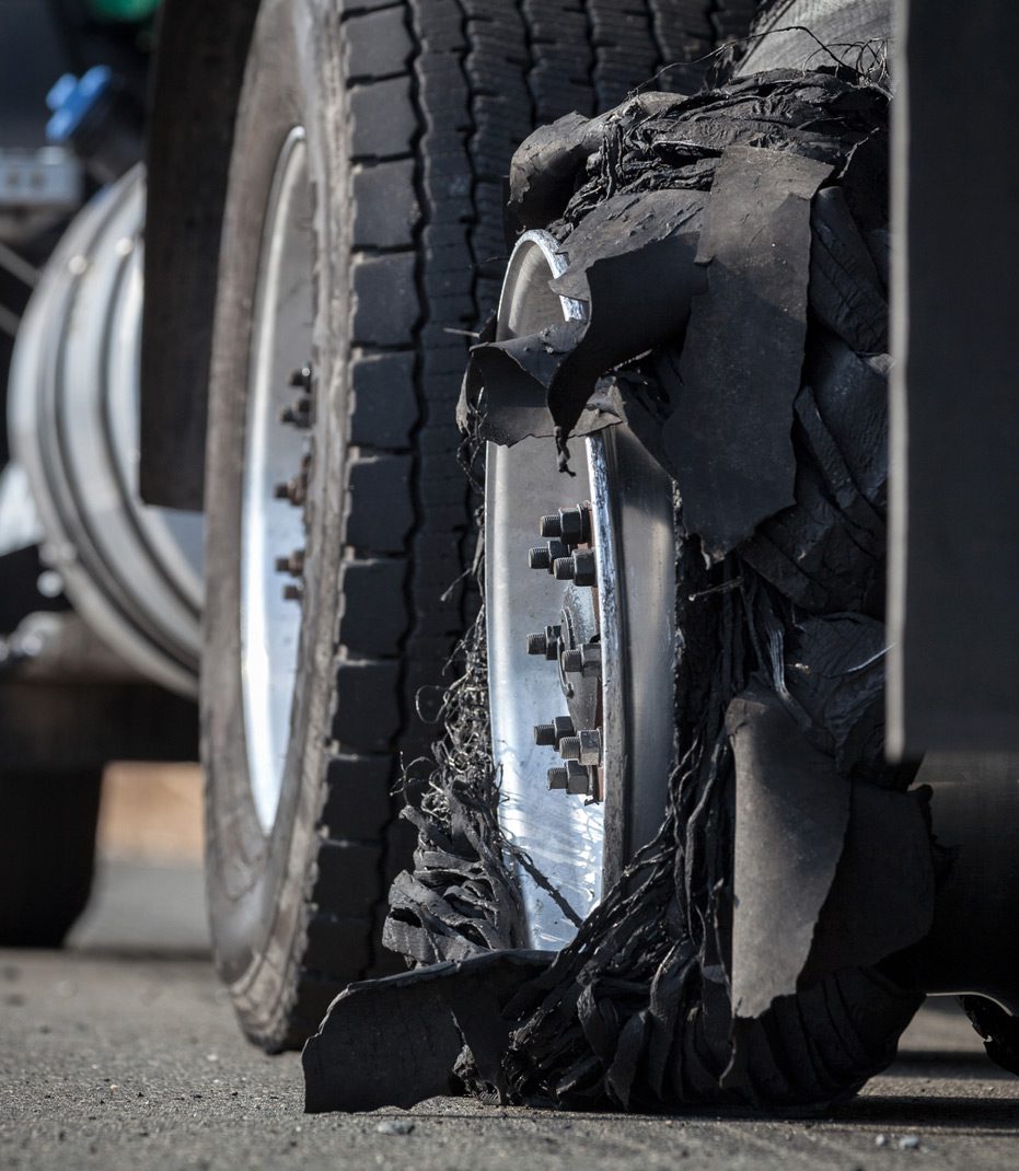 Up-close-image-of-a-tire-blowout-on-a-truck