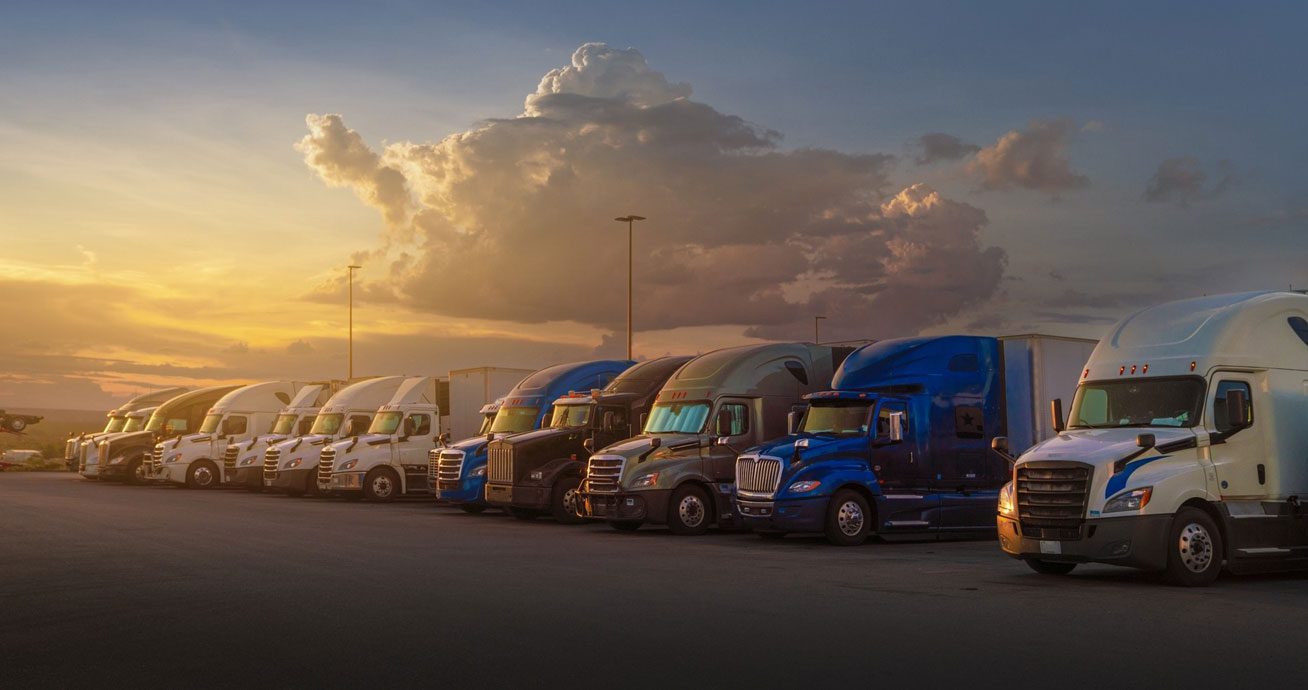 Cargo-truck-driving-on-highway-with-wet-road-and-dark-clouds