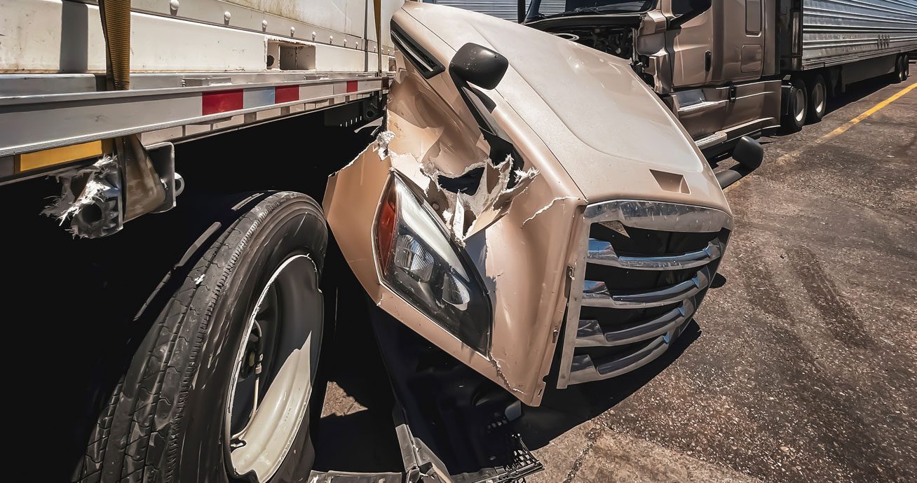 Damaged-truck-cab-after-collision-with-trailer