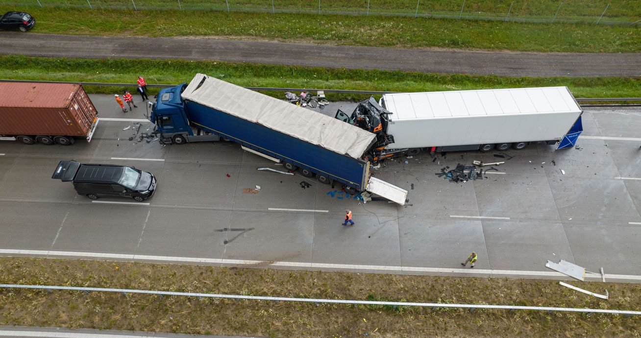 Long-haul-semi-truck-driving-on-highway-at-sunset
