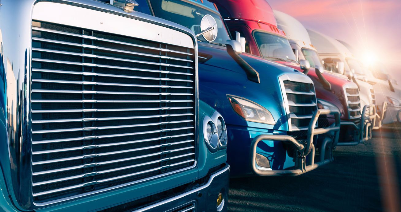 Row-of-semi-truck-fronts-parked-side-by-side