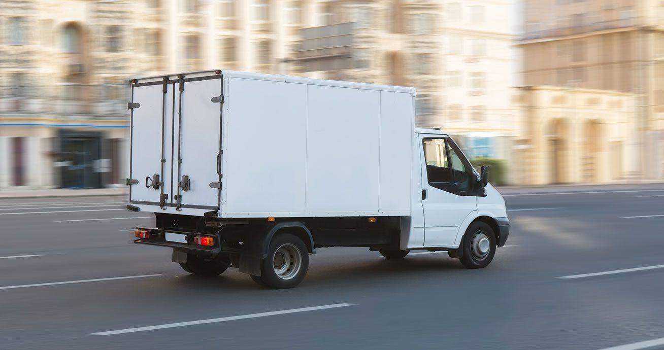 Semi-truck-driving-along-road-with-visible-lane-markings