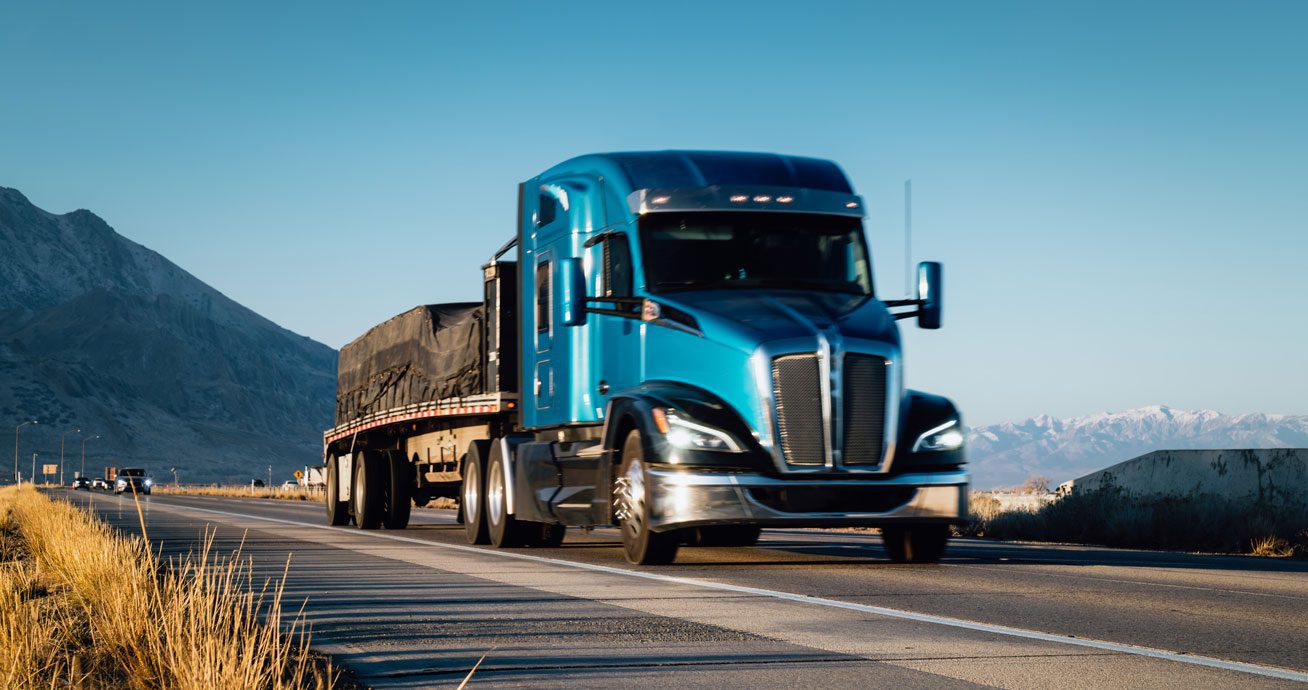 Semi-truck-driving-along-winding-mountain-highway