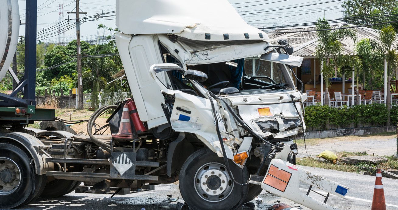 Tanker-truck-with-visible-damage-and-tank-structure-on-roadway