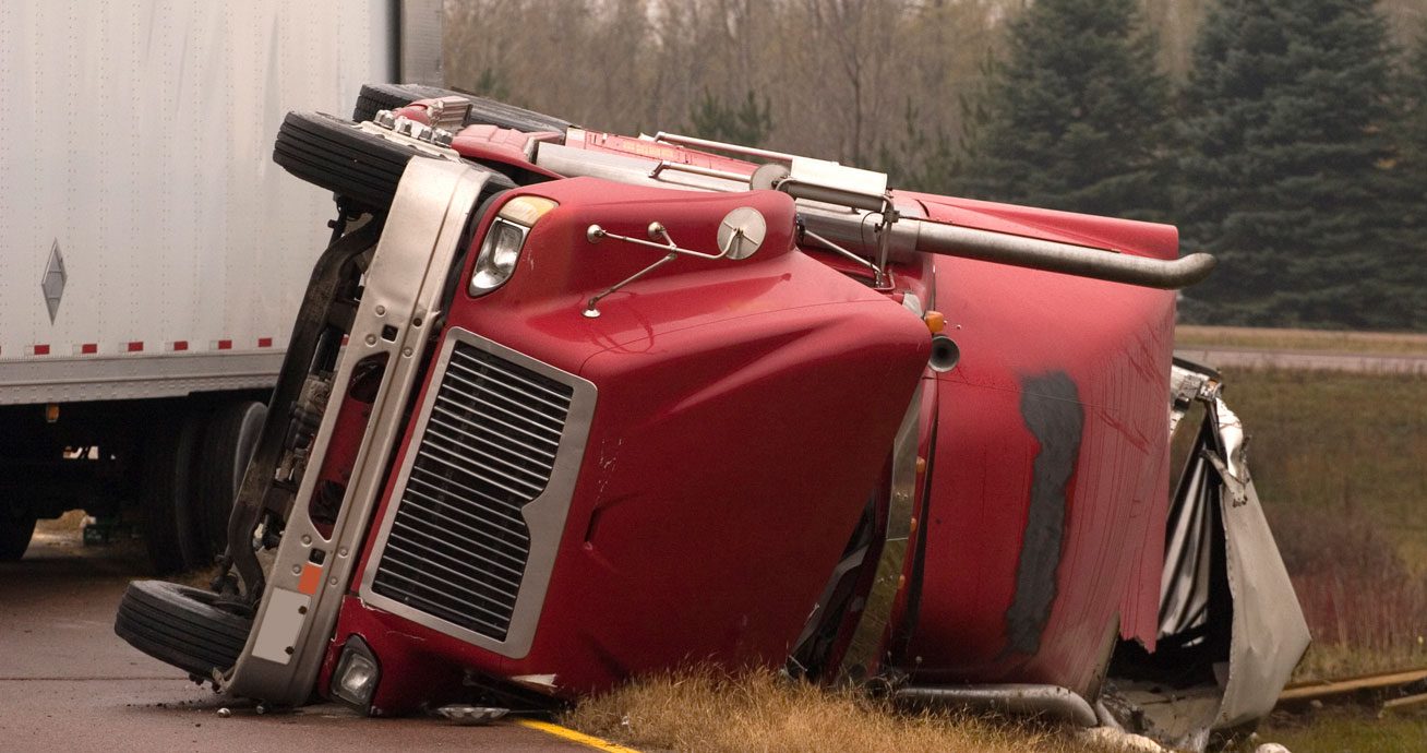 Overturned-semi-truck-blocking-roadway-after-crash