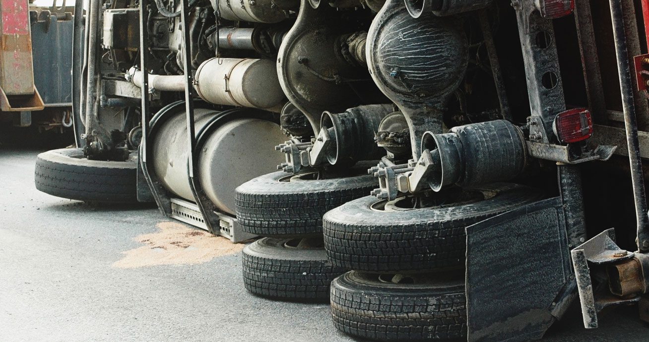Underside-of-overturned-truck-with-wheels-and-axles-visible